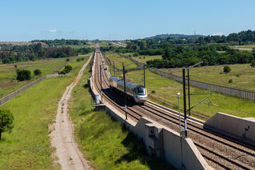Gautrain, high speed train traveling from Pretoria to Sandton going past Solomon Mahlangu drive,...
