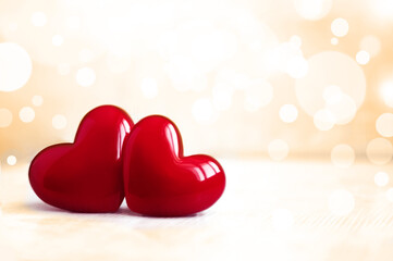 Valentines day background with shiny plastic hearts on light. Happy lovers day card,