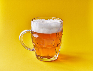  One jar of beer over yellow background