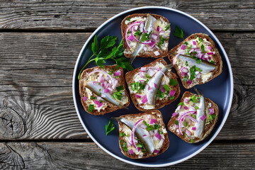 pickled sprat rye bread open sandwiches, top view