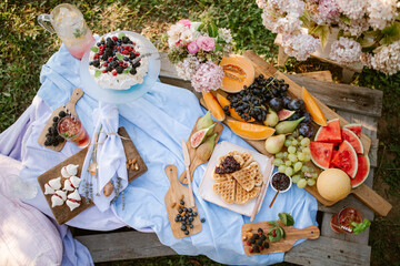 Picnic table with fruit in garden
