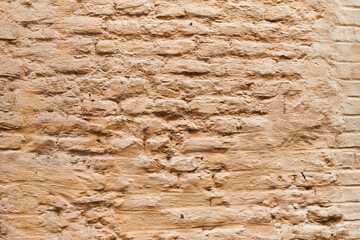  Painted yellow brick wall surface background