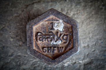 Iron 1 kilogram weight in Bhutan (with the following text Bhutanese: kilogram and kg) in Southeast...