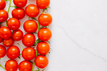 Healthy fresh tomatoes on a white background. Top view. salat with tomatoes cherry. Mediterranean salad with cherry tomatoes. Copy space. Greece