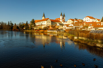 Castle Park and Telc Castle. View of the city of Telc in the winter sunset.
The picturesque castle and the historic center with the decorative facades of the houses belong to the UNESCO World Heritage