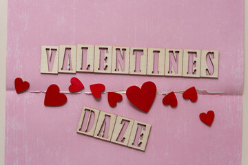 valentines daze with grungy hearts on torn paper