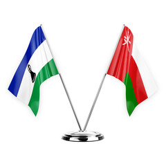 Two table flags isolated on white background 3d illustration, lesotho and oman