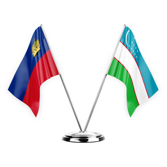 Two table flags isolated on white background 3d illustration, liechtenstein and uzbekistan