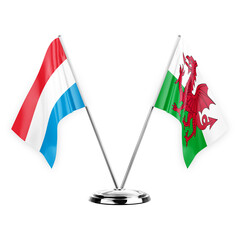 Two table flags isolated on white background 3d illustration, luxembourg and wales