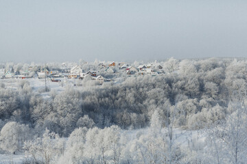 Fototapeta na wymiar Winter landscape with trees covered with hoarfrost.