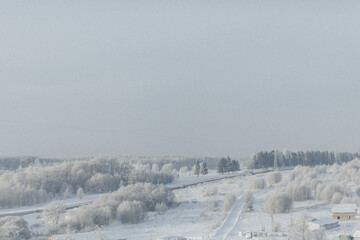 Winter landscape with trees covered with hoarfrost.