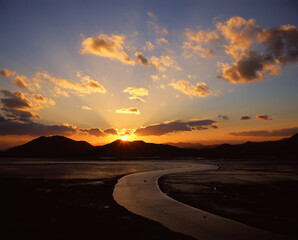 The orange sunset in Suncheon Bay in autumn.