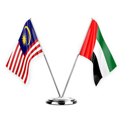 Two table flags isolated on white background 3d illustration, malaysia and united arab emirates