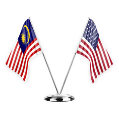 Two table flags isolated on white background 3d illustration, malaysia and usa