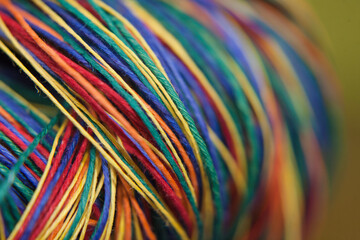Colorful strings close up rolled up together. Rainbow, linen or cotton string .  Thick thread.