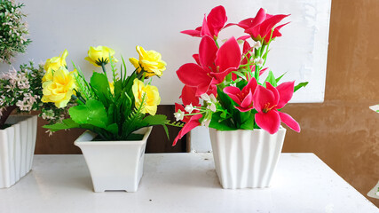 artificial bouquet of roses and lilies in pots, home interior and exterior decoration