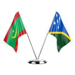 Two table flags isolated on white background 3d illustration, mauritania and solomon islands