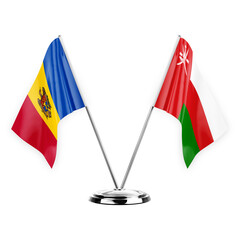 Two table flags isolated on white background 3d illustration, moldova and oman