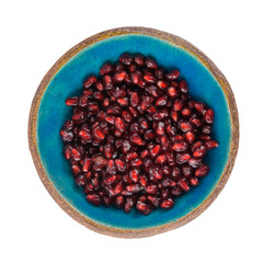 Pommegranate seed on blue ceramic bowl