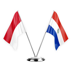 Two table flags isolated on white background 3d illustration, monaco and paraguay