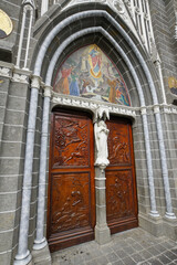 Ipiales, Colombia: Carved-wood doors with mosaic and ornamentation mark a side entrance to Santuario Nuestra Señora de las Lajas (Las Lajas), a neo-Gothic Roman Catholic basilica