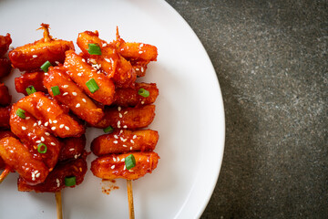 deep fried Korean rice cake (Tteokbokki) skewered with spicy sauce