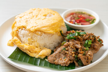 egg on topped rice with grilled pork and spicy sauce