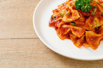 farfalle pasta in tomato sauce with parsley