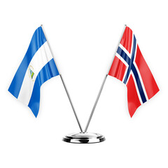 Two table flags isolated on white background 3d illustration, nicaragua and norway