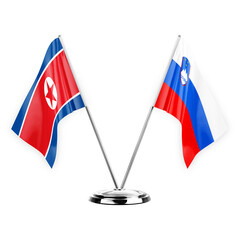 Two table flags isolated on white background 3d illustration, north korea and slovenia