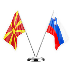 Two table flags isolated on white background 3d illustration, north macedonia and slovenia