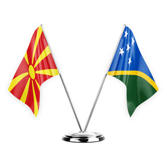 Two table flags isolated on white background 3d illustration, north macedonia and solomon islands