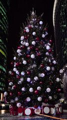 Decorated Christmas tree on the street at night. Night view of a Christmas tree in Moscow International Business Center for the celebration of Christmas and New Year