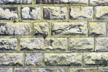 Rectangular Stone Blocks with Raised Mortar Joints in Old Rough Textured Wall
