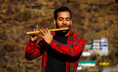 bansuri indian instrument man with flute indian bansuri Close view image