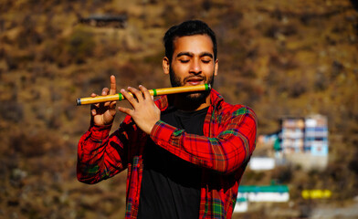 bansuri indian instrument man with flute indian bansuri Close view image © FireFXStudio