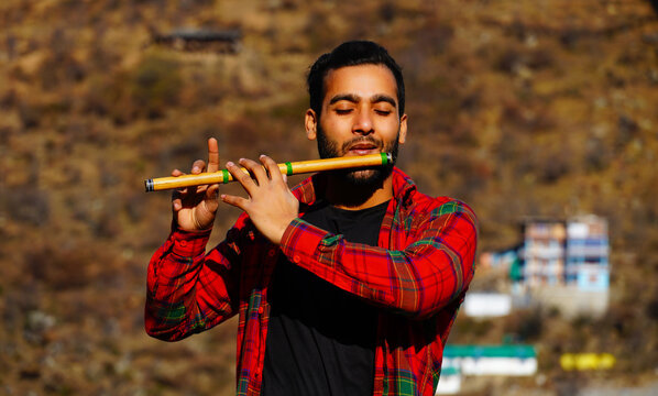 man with flute indian bansuri Close view image