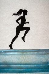 Silhouette of woman running on surface made of a respirator mask