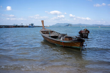 The wooden boat in the day time. Very nice view at the beautiful beach of Thailand.