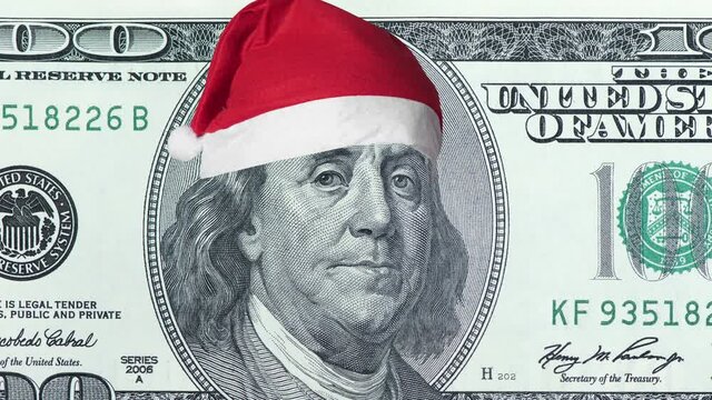 Old One hundred dollar bill old 2006 banknote in christmas hat. 100 dollar banknote. 4k high quality footage
