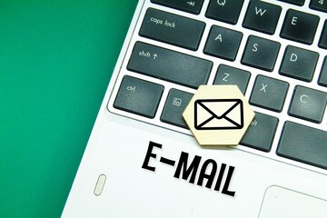laptop keyboard, hexagon with email icon and email word