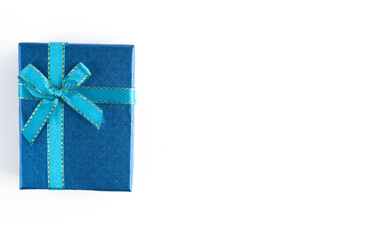 Blue gift box with ribbon for Christmas, New Year, birthday on white background