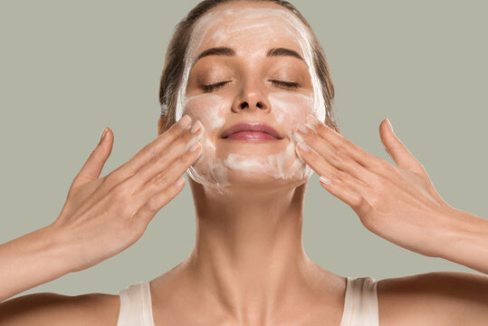 Soap face woman clean skin beauty. Color background. Green