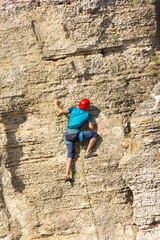 climber climbs the cliff alone