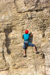 climber climbs the cliff alone