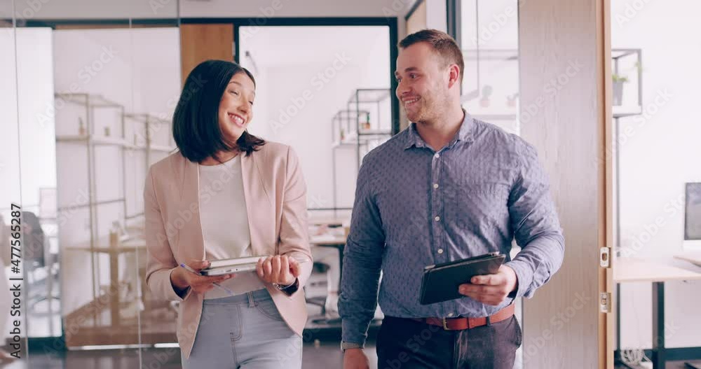 Aufkleber business employees walking in a modern modern office. two diverse working colleagues talking about a