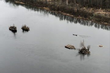 the boat is floating on the river