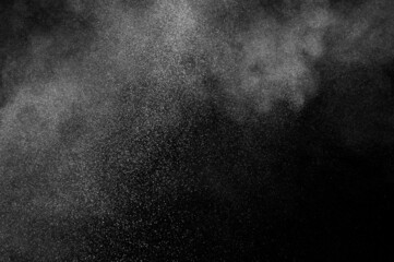 Fototapeta na wymiar White powder explosion on black background. Abstract white dust texture.