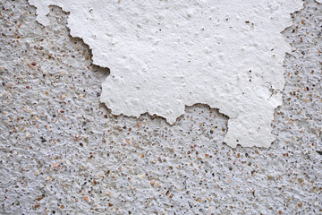 Abstract old white concrete wall with peeling paint