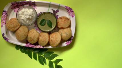 Appum or Appe, Appam or Mixed dal or Rava Appe served with green   chutney. A Ball shape popular south Indian breakfast dish, Selective focus
